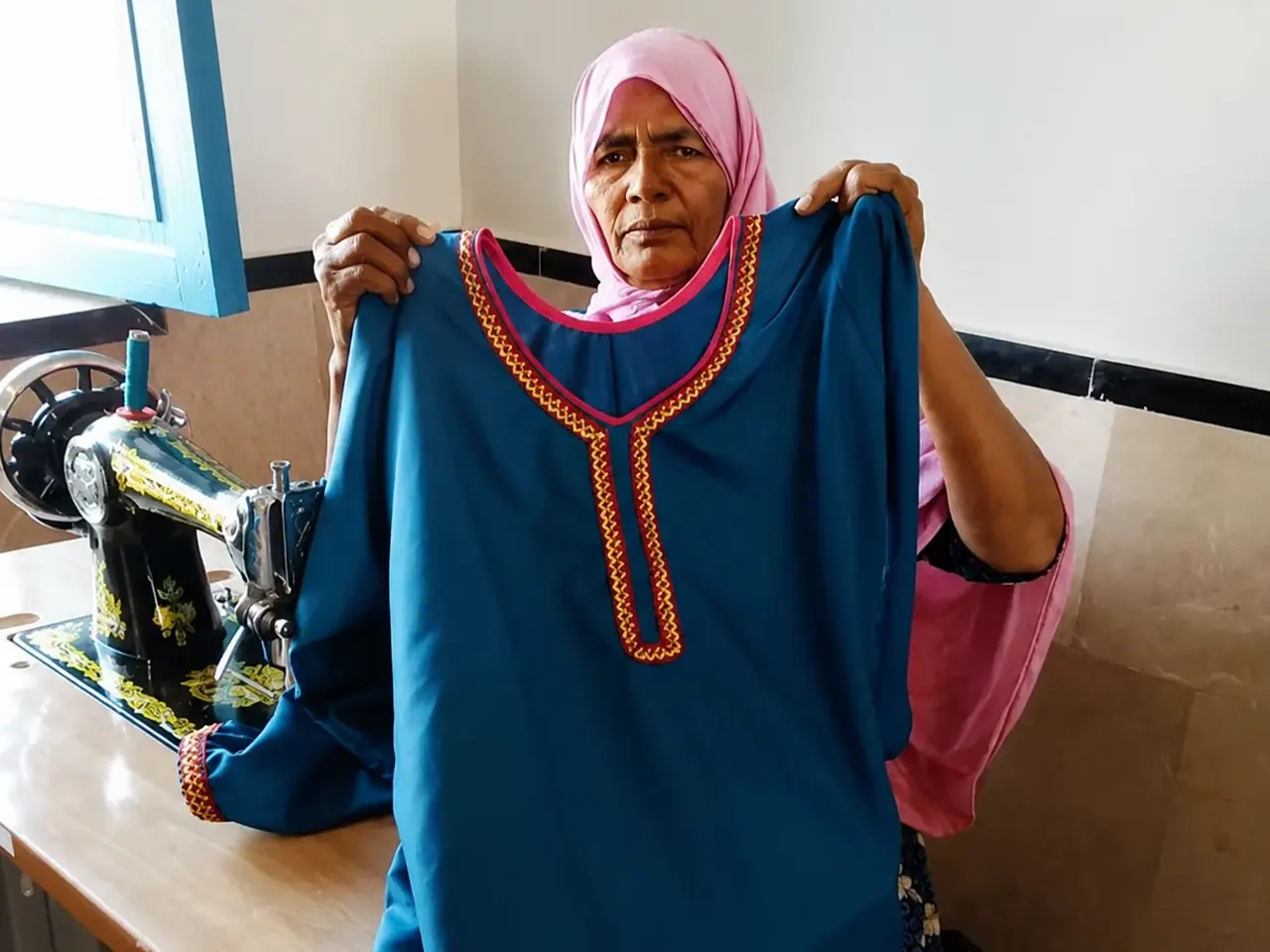 Sairah Amro displaying a garment she stitched